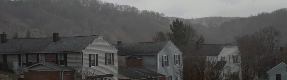 Pennsylvania hillside borough with rows of modest brick and sided homes on steep streets