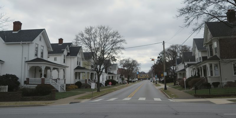 Pennsylvania small-town residential street of Victorian and foursquare houses with deep porches
